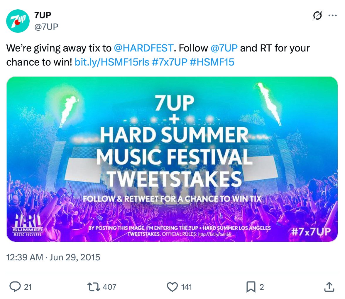 Colorful festival crowd and stage lights promoting the 7UP + HARD Summer Music Festival tweetstakes