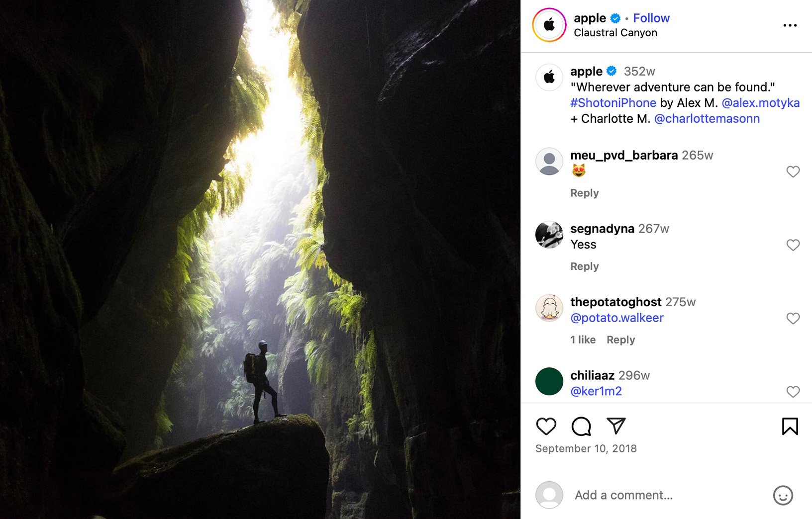 A hockey player skates on a frozen lake in Canada with snowy mountains in the background and a clear blue sky above