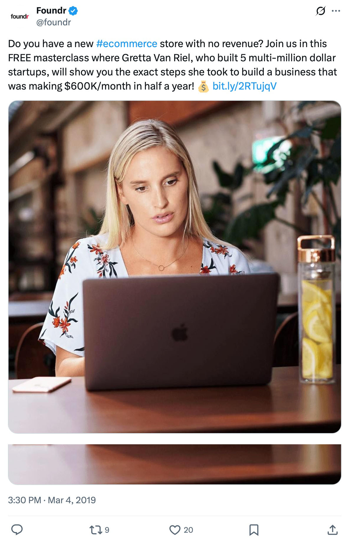 Gretta Van Riel working on a laptop at a cafe