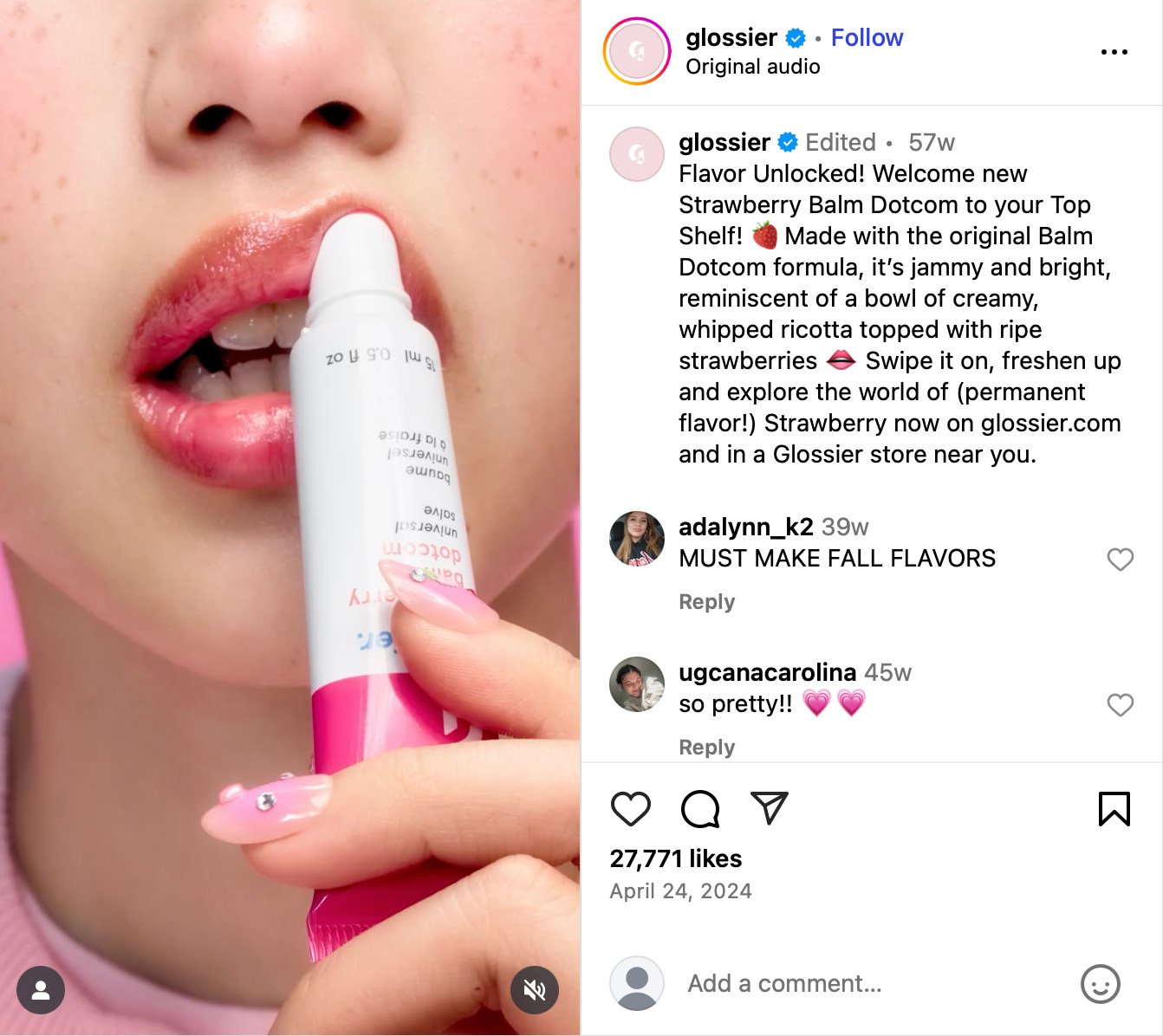 Close-up of a person applying Glossier Strawberry Balm Dotcom to their lips with glossy pink nails