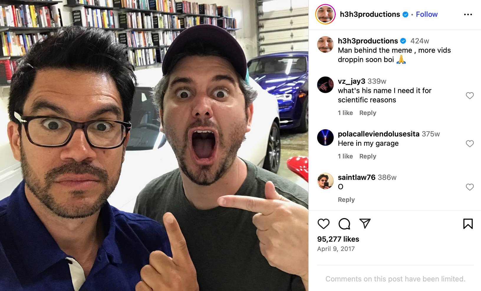 Ethan Klein of h3h3productions pointing at Tai Lopez inside a garage full of cars and bookshelves