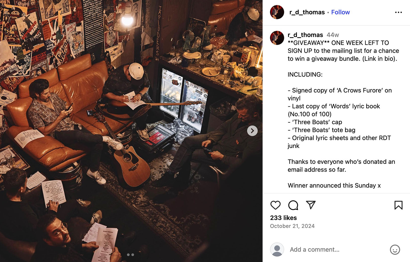 Musicians sitting in a cosy room surrounded by posters and instruments while preparing giveaway lyric sheets and vinyl