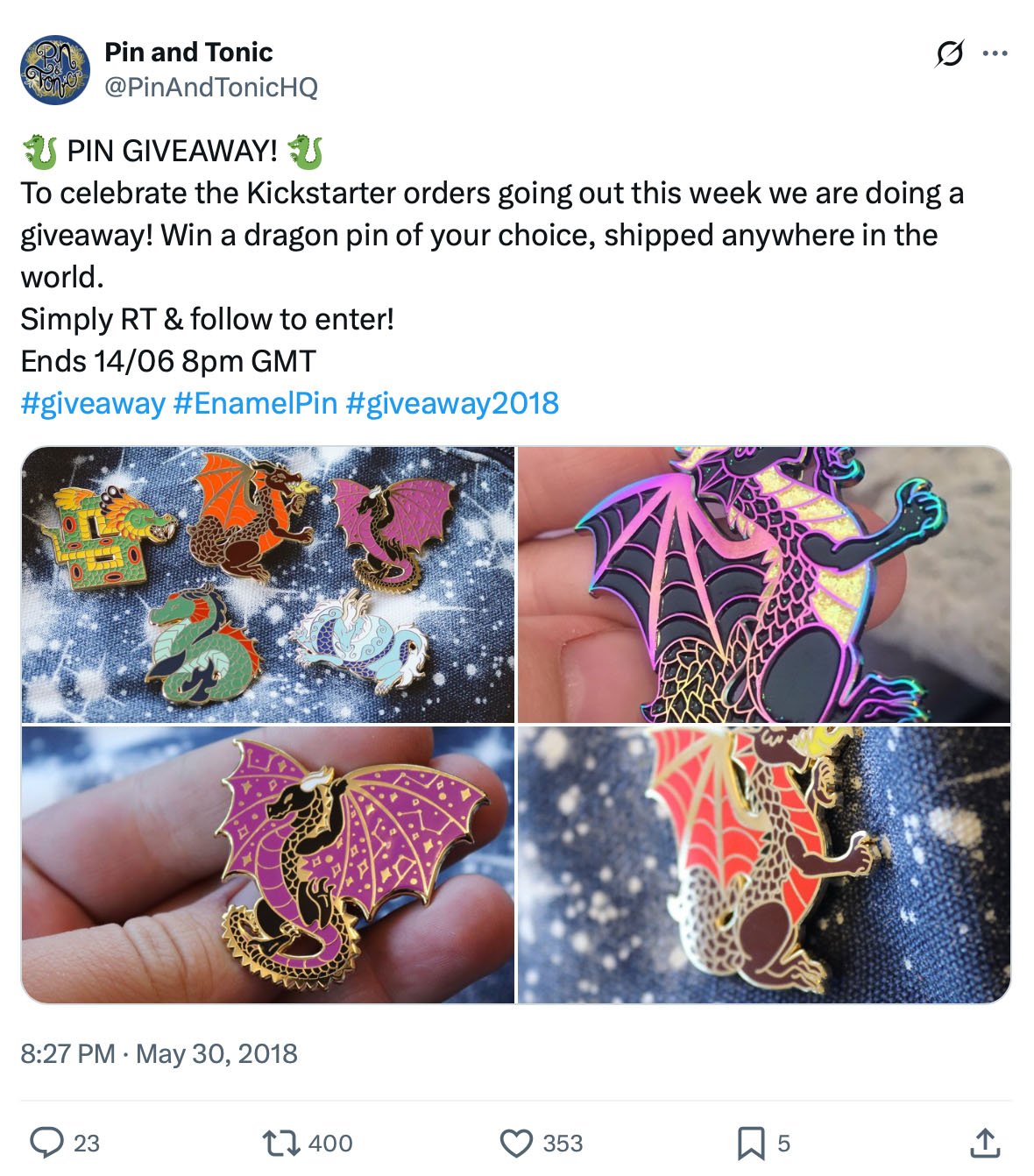 Four dragon enamel pins in different colours displayed for a giveaway