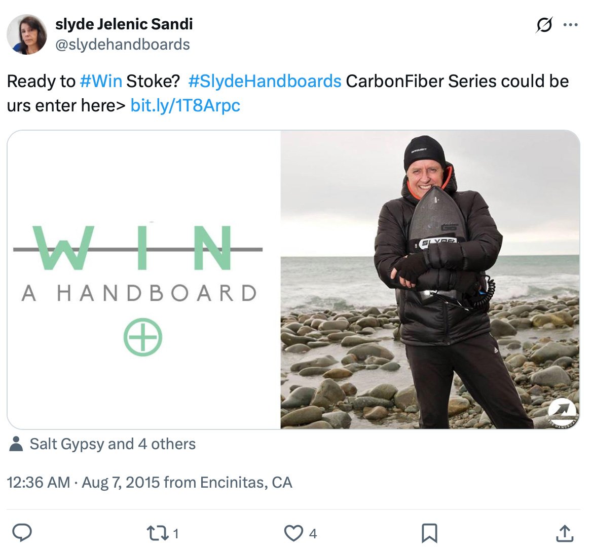 Giveaway post featuring a man on a rocky beach holding a Slyde Handboard with text promoting a chance to win