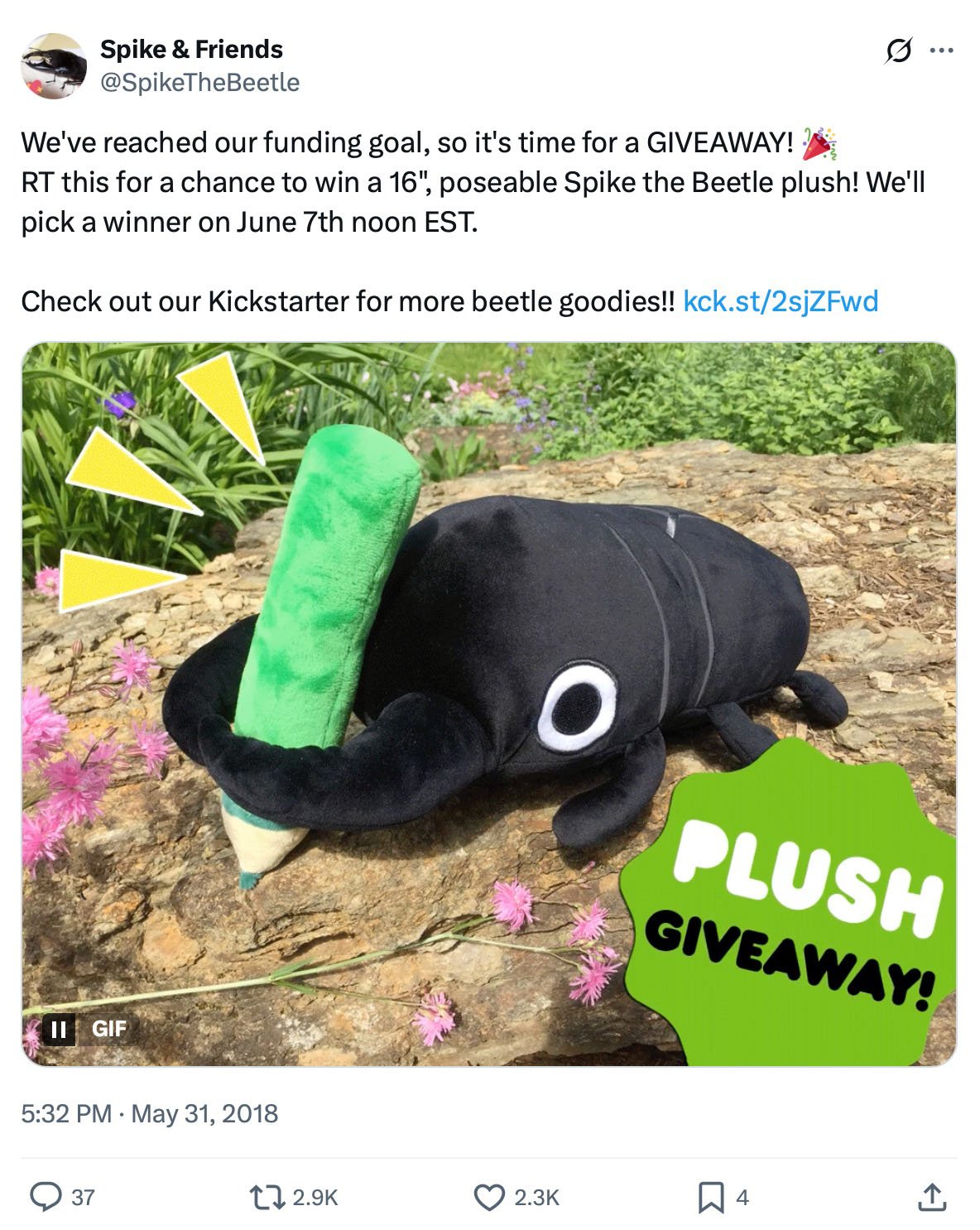 Spike the Beetle plush holding a green crayon with 'Plush Giveaway' text overlay